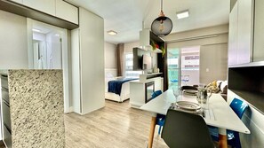 1 bedroom, desk, iron/ironing board, travel crib