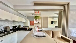 Fridge, microwave, stovetop, coffee/tea maker