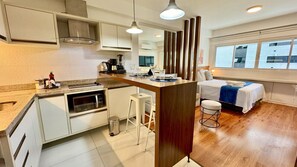 Fridge, microwave, stovetop, coffee/tea maker