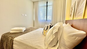 1 bedroom, desk, iron/ironing board, travel crib