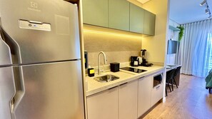 Fridge, microwave, stovetop, coffee/tea maker