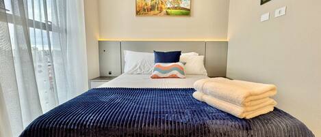 1 bedroom, desk, iron/ironing board, travel crib