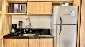 Fridge, microwave, stovetop, coffee/tea maker