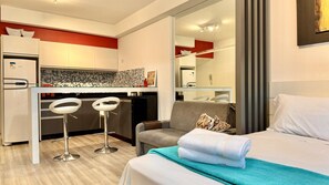 1 bedroom, desk, iron/ironing board, travel crib