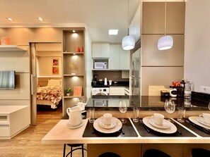 Fridge, microwave, stovetop, coffee/tea maker