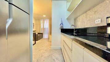 Fridge, microwave, stovetop, coffee/tea maker