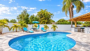 A swimming pool with lounge chairs and a pergola. - Dream Gateway, Luxury, Exclusive (Bradenton)