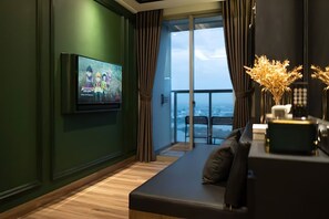 Deluxe Apartment, 2 Bedrooms, Balcony, City View | Living area | 42-inch flat-screen TV with cable channels - Seaview GoldCoast Residence in Jakarta (Jakarta)