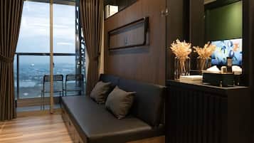 Deluxe Apartment, 2 Bedrooms, Balcony, City View | Living area | 42-inch flat-screen TV with cable channels