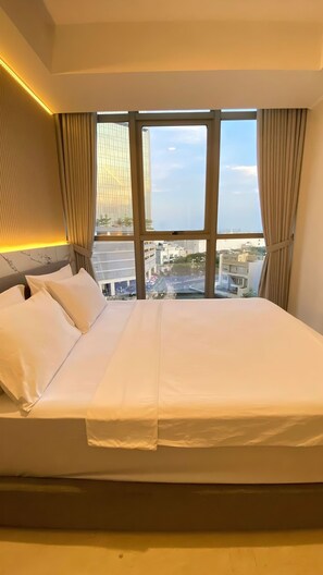 Deluxe Apartment, 2 Bedrooms, Balcony, City View | Minibar, blackout drapes, soundproofing, free WiFi - Seaview GoldCoast Residence in Jakarta (Jakarta)