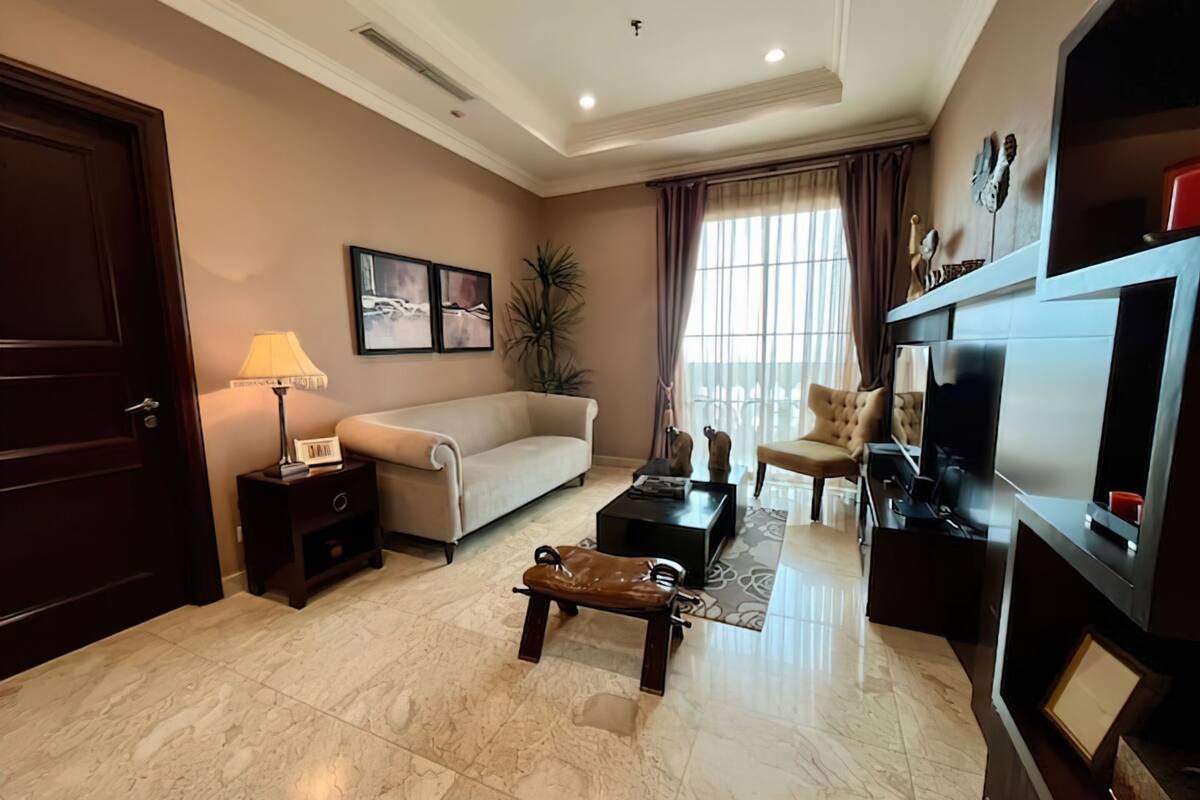 Deluxe Apartment, 2 Bedrooms, Balcony, City View | Living area | 42-inch flat-screen TV with cable channels
