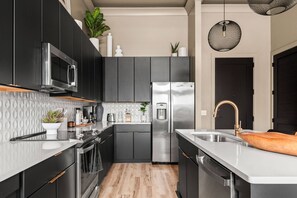 Fridge, microwave, dishwasher, coffee/tea maker