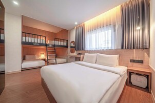 Family Room | Premium bedding, pillow-top beds, desk, laptop workspace