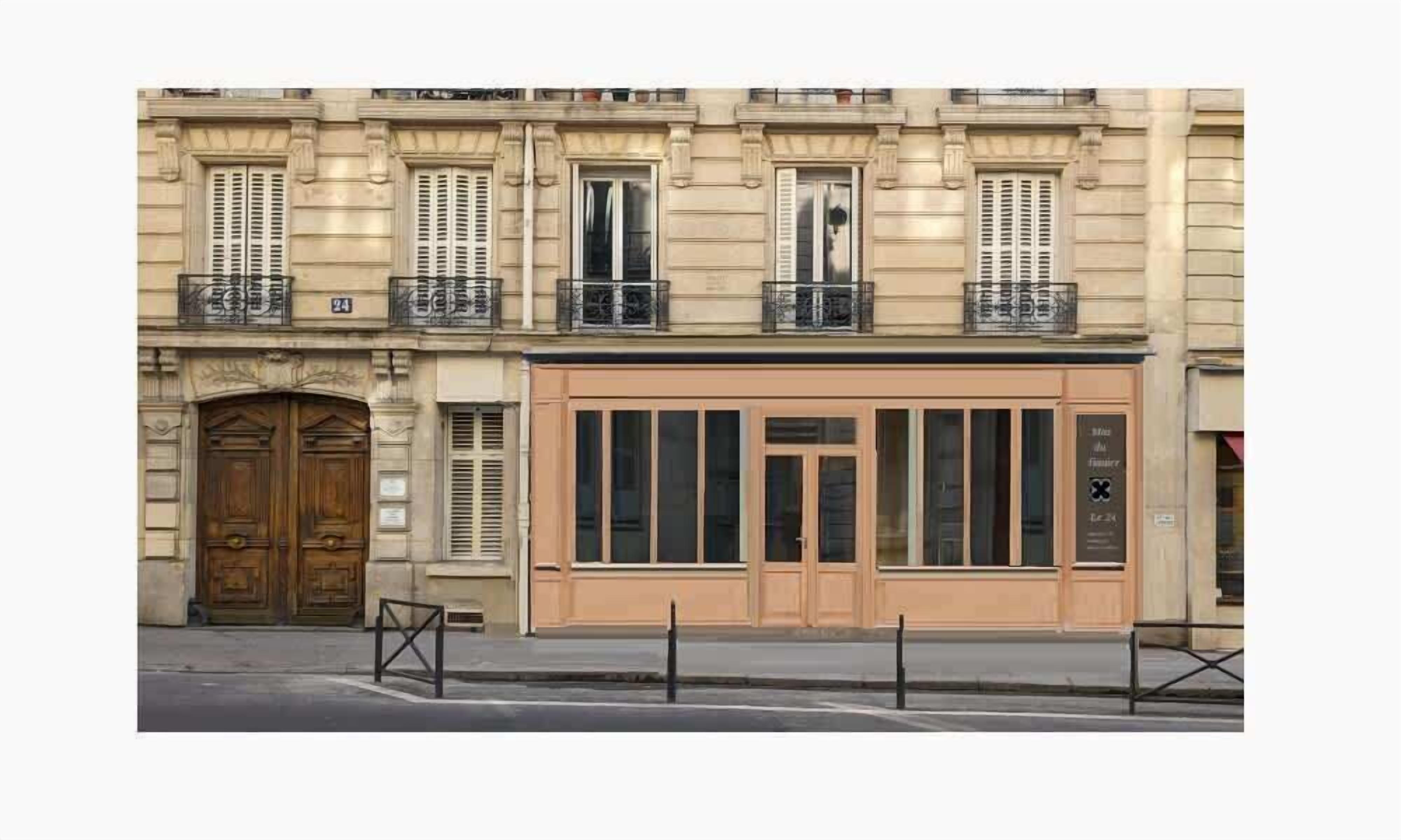 A building facade with a large wooden door, multiple windows with shutters, and a balcony with metal railings.