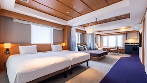 A hotel room with two beds, a dining area, and a kitchenette. - HANARE by Tokyu Stay Kyoto Sanjo (Kyoto)