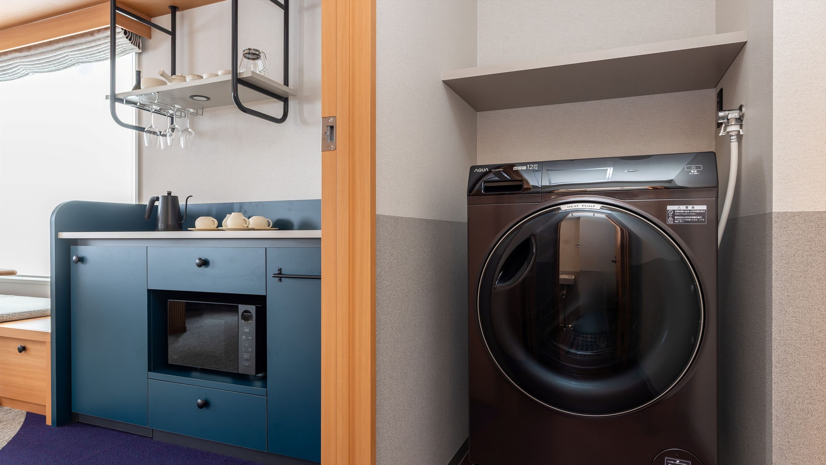A compact kitchen with a built-in oven and a washing machine.