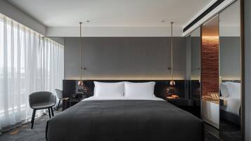 Deluxe King Room | In-room safe, blackout drapes, iron/ironing board, free WiFi