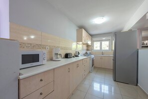 Enjoy cooking in this well-equipped kitchen with appliances and ample natural light.