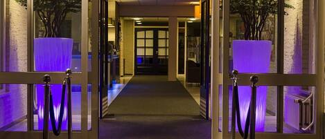 Enter through the beautifully landscaped entrance, flanked by lush greenery, into our welcoming hotel.