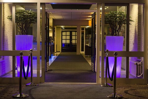 Enter through the beautifully landscaped entrance, flanked by lush greenery, into our welcoming hotel.