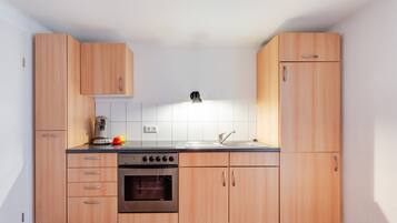 Fridge, stovetop, cookware/dishes/utensils