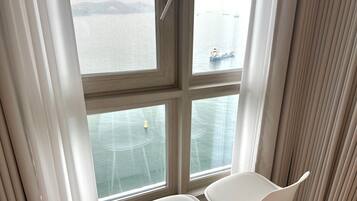 Junior Double Room, Beach View | Living area | Flat-screen TV