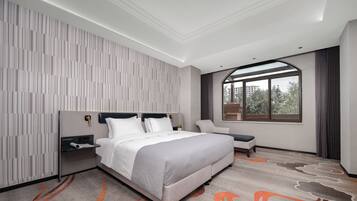 Comfort Suite, Garden View | In-room safe, blackout drapes, iron/ironing board, free WiFi
