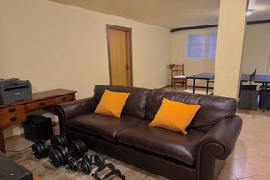 Family House, Multiple Bedrooms (Pianello Bellavista) | Living area | 21-inch TV with satellite channels