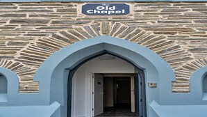 A stone building with a sign reading "The Old Chapel." - Chapel in Newquay near Towan Beach (Newquay)