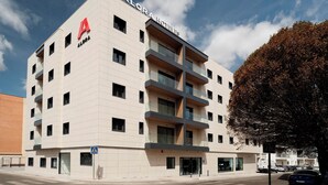 A multi-story hotel with a prominent 'A' logo, a modern architectural design, and a visible entrance. - Alora Hotel Mérida  (Mérida)