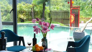 Deluxe Double Room, Pool View | 1 bedroom, desk, laptop workspace, soundproofing