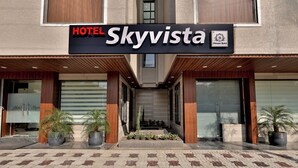 A hotel entrance with a sign reading "HOTEL Skyvista." - Hotel Skyvista (Indore)