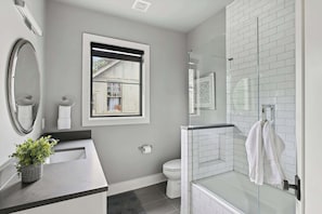 Shower, hair dryer, towels, shampoo