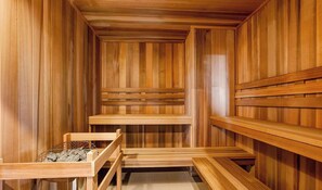 A sauna with wooden benches and a bench with a metal frame. - The Highland Retreat - Gym, Sauna, Pool & Spa (Windsor)