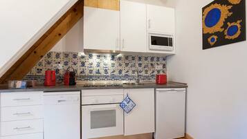 Espresso maker, electric kettle, dining tables