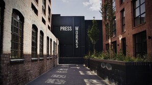 A narrow alleyway with brick buildings, one labeled "PRESS WORKS". - The Brickworks - Grade II Boutique Stay, 2 Bed. (Birmingham)