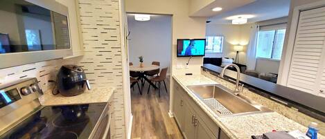 Microwave, dishwasher, coffee/tea maker, cookware/dishes/utensils