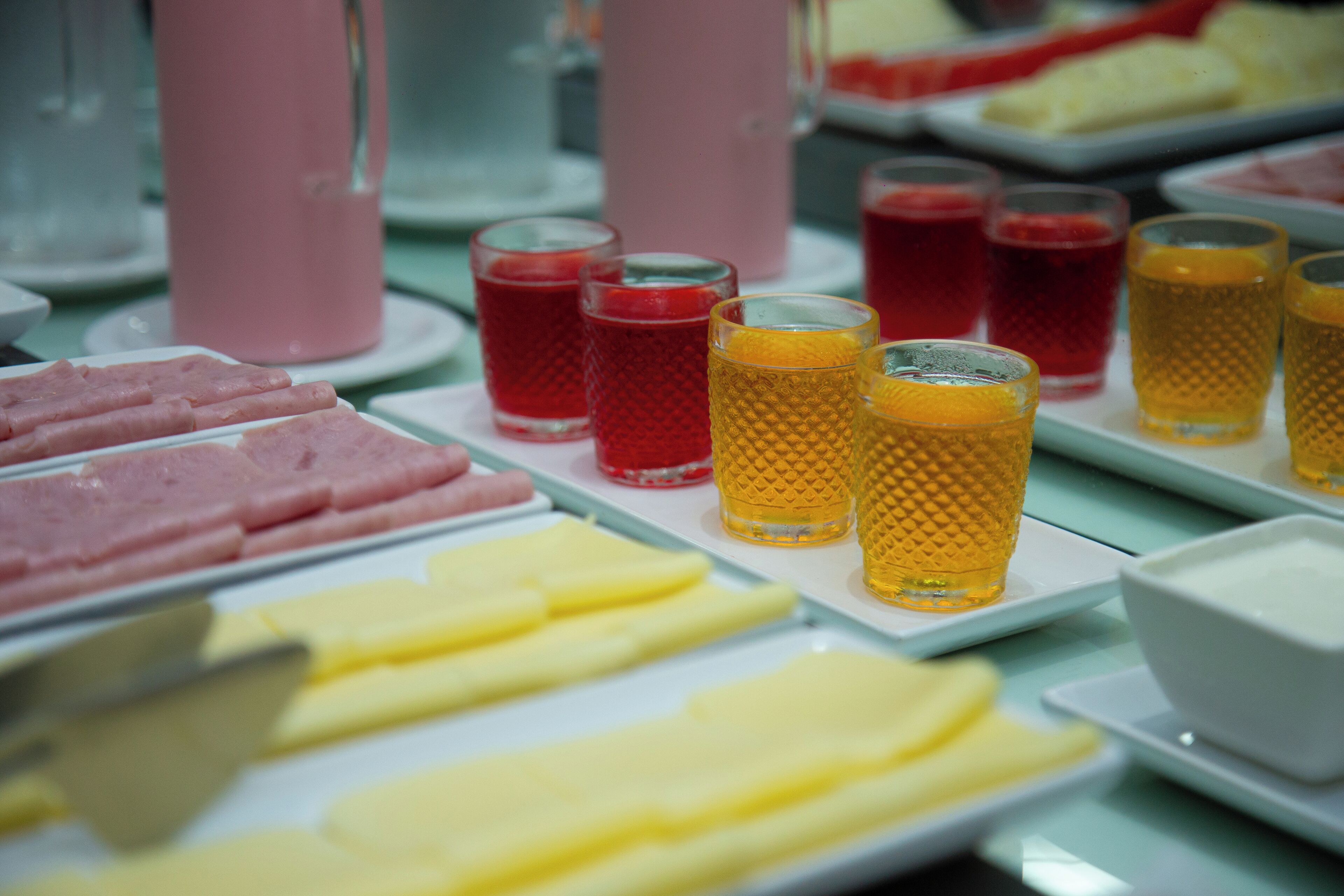 A buffet with various food items and beverages.