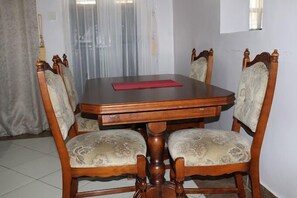 Apartment, Garden View | Living area | 24-inch Smart TV with digital channels - Avishai Homes Kisumu (Kisumu)