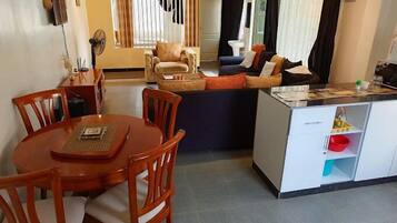 Classic Apartment, Garden View | Living area | 24-inch Smart TV with digital channels