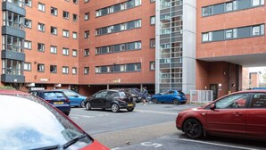A multi-story parking garage with cars parked in designated spaces. - Belgrave View - Campus Accommodation (Birmingham)