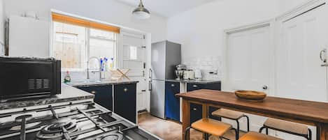 Coffee/tea maker, fridge, microwave, oven