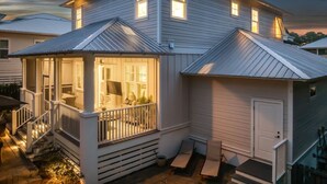 A two-story house with a porch, a covered entryway, and a garage. - Private Pool | LSV | Bikes (Santa Rosa Beach)