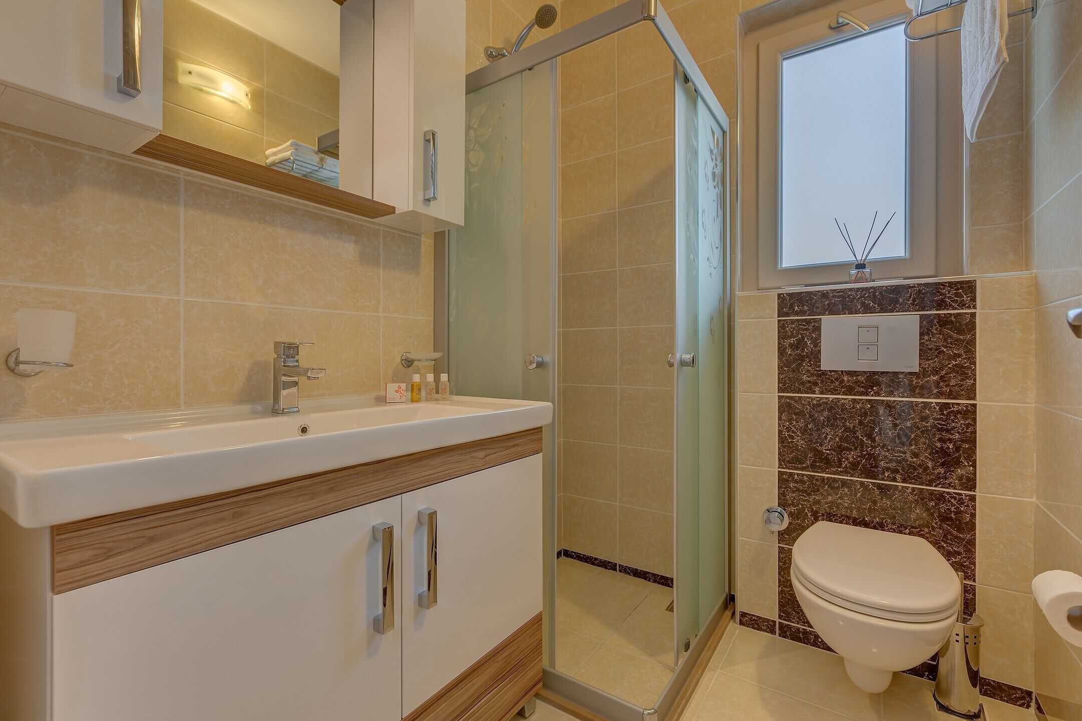 Shower, free toiletries, hair dryer, slippers