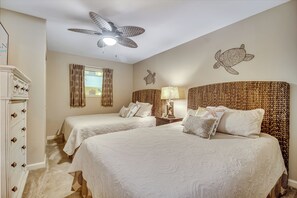 A bedroom with two beds, a ceiling fan, a wall mural of a turtle, and a window with curtains. - 3BR- 5th floor- Lake & Golf View condo|Short walk to beach| Resort Access| (North Myrtle Beach)