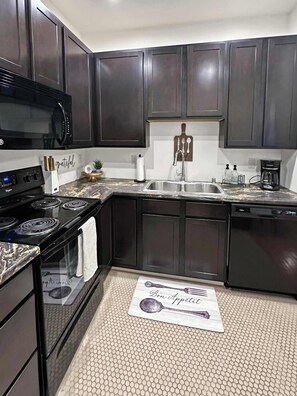 Fridge, microwave, oven, stovetop - River City Apartment #1 with flex space (La Crosse)