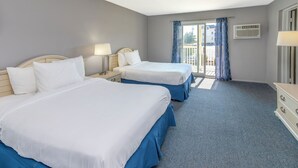 A hotel room with two beds, a balcony with a view, and an air conditioning unit. - The Beach House at Drifting Sands (Beach Haven)