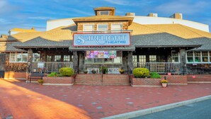 A building with a sign reading "Surflight Theatre" and a brick facade. - The Beach House at Drifting Sands (Beach Haven)
