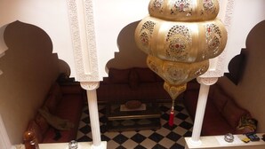 A grand lobby with a checkered floor, ornate columns, and a decorative hanging lamp. - MARRAKECH RYAD ALL COMFORTS IN A RESIDENCE WITH 3 LARGE SWIMMING POOLS (Marrakech)