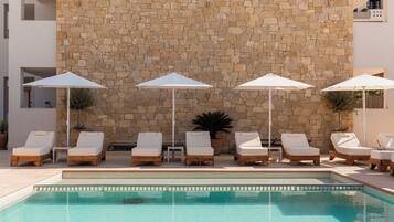 Seasonal outdoor pool, pool umbrellas, pool loungers
